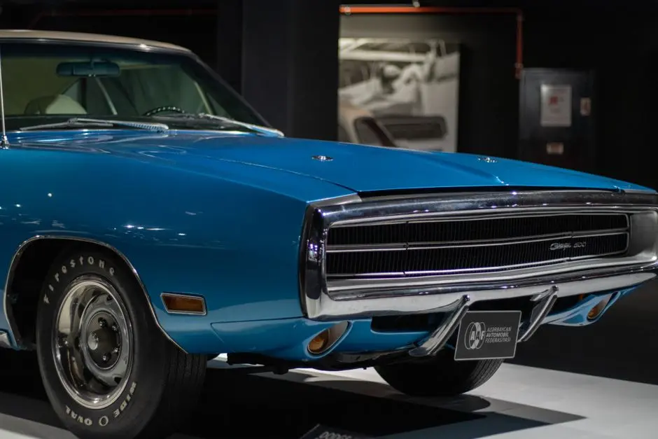 Vintage blue Dodge Charger showcased at an exhibition in Baku, Azerbaijan.
